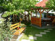 Garden with deck-beds and a pergola